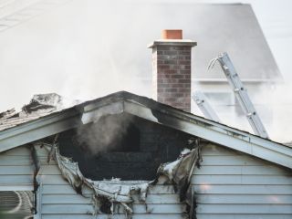 Technicians performing fire damage restoration in a residential property in Bell Gardens